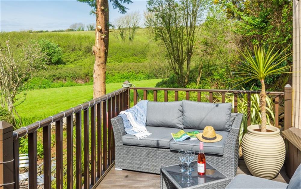 Views over the communal gardens and countryside beyond from the private deck at Harvest Barn in South Allington