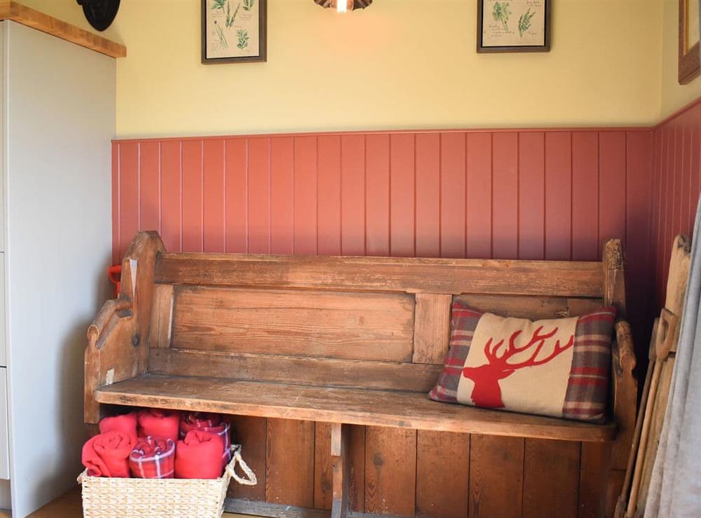 Rustic bench seating by  the back door