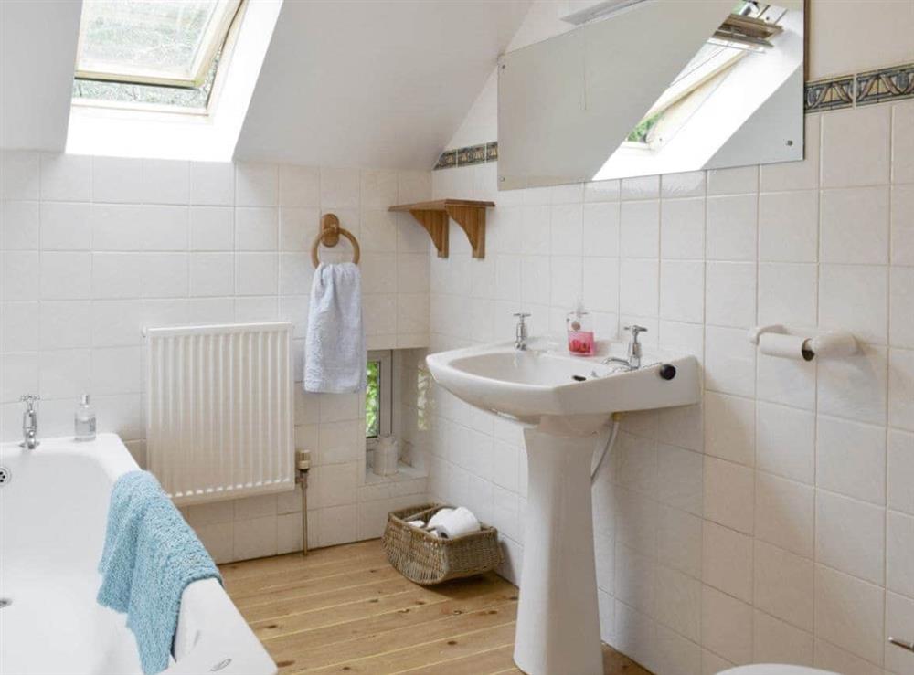 Bathroom with shower over bath at Osprey Cottage, 