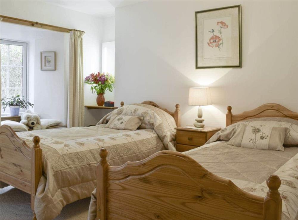 Comfortable twin bedroom at Osprey Cottage, 