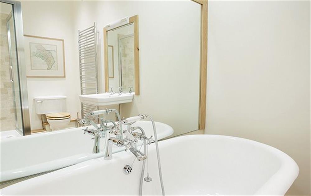 First floor: The Master en-suite bathroom with bath and separate shower at Hause Hall, Cruick Barn & The Stables, Hallin Fell