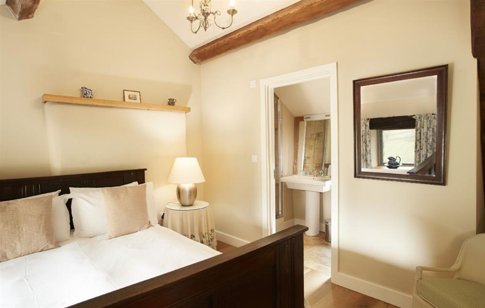 First floor double bedroom with en-suite shower room at Hause Hall Farm and Cruick Barn, Hallin Fell