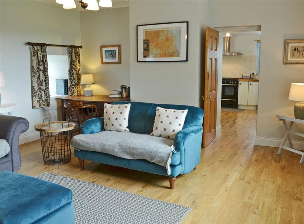 Tastefully furnished living room with wood burner at Havannah Cottage in Alnham, near Rothbury, Northumberland