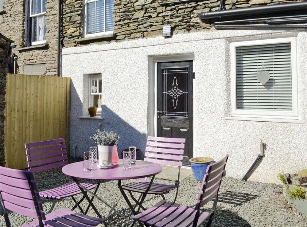 Attractive sitting out/outdoor eating area to rear of property at Havelock Cottage in Windermere, Cumbria
