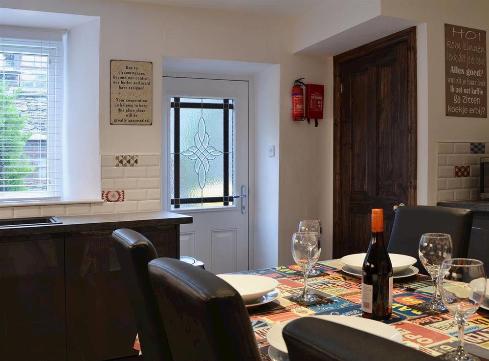 From the kitchen/diner access to the garden/patio is via the back door at Havelock Cottage in Windermere, Cumbria