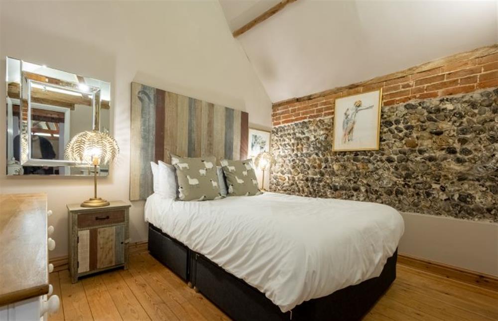 Master bedroom  with king-size bed at Hawthorne Cottage, Roughton near Norwich