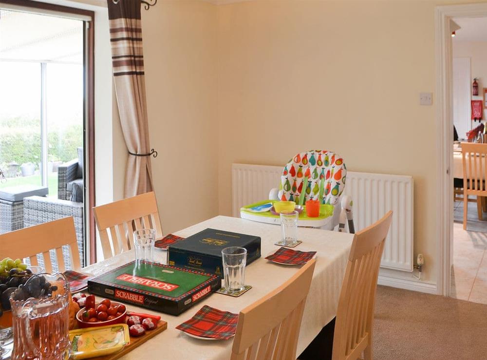 Dining room with access to the sun room at Hawthorne House in Amble, near Warkworth, Northumberland