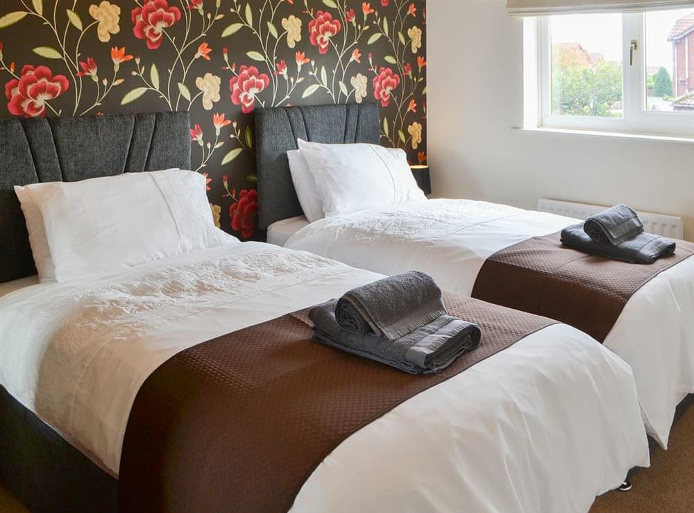 Relaxing twin bedded room at Hawthorne House in Amble, near Warkworth, Northumberland