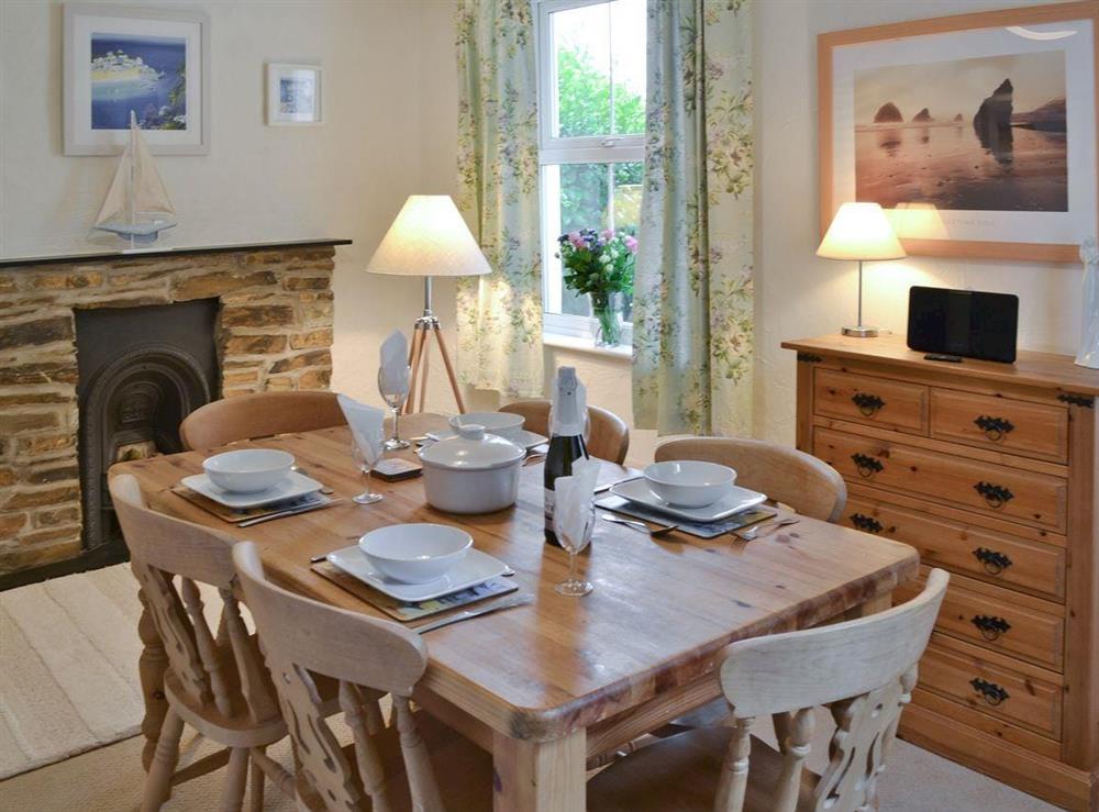 Dining room with heritage fireplace at Hay Cottage in St Austell, S. Cornwall., Great Britain