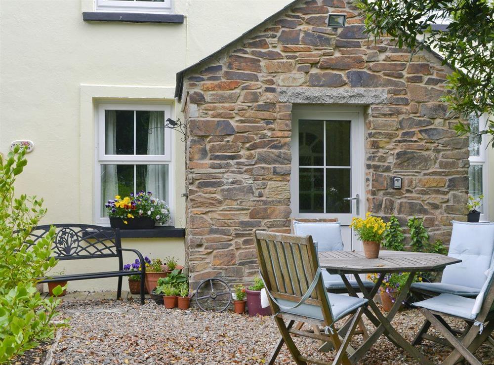 Gravelled patio with outdoor furniture at Hay Cottage in St Austell, S. Cornwall., Great Britain