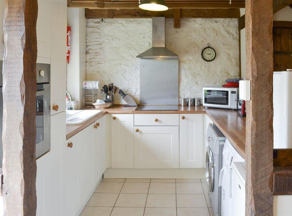 Well-equipped fitted kitchen at Haybarn in Fowey, Cornwall
