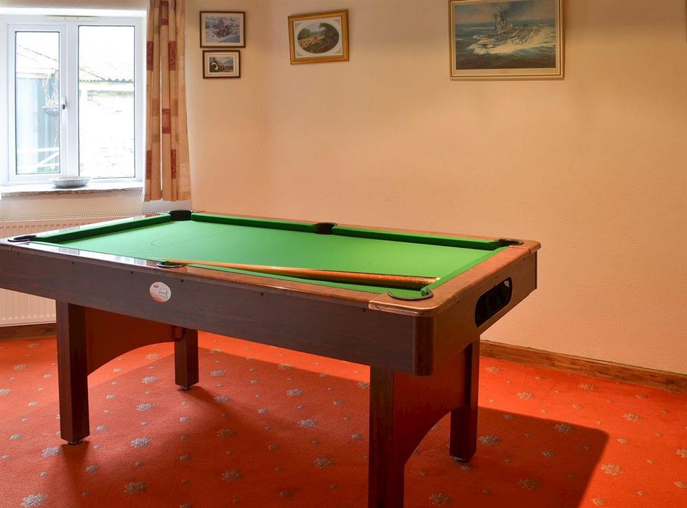 Games room adjoining the living area at Haycombe Cottage in Camelford, Cornwall