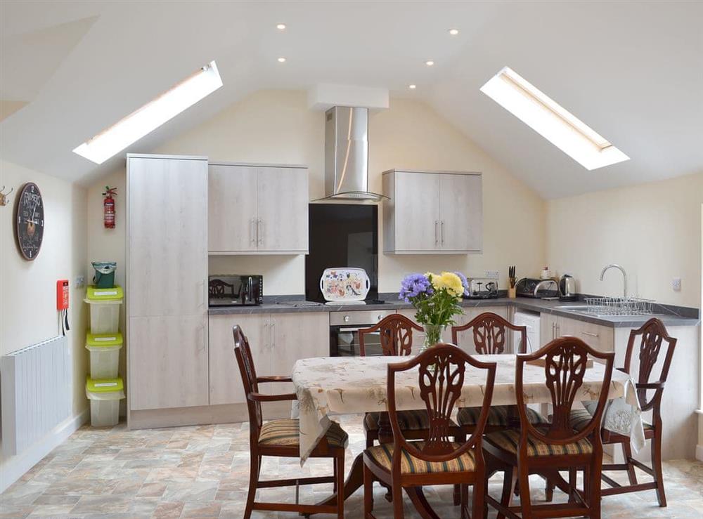 Light and bright kitchen and dining areas at Scrumpy Barn, 