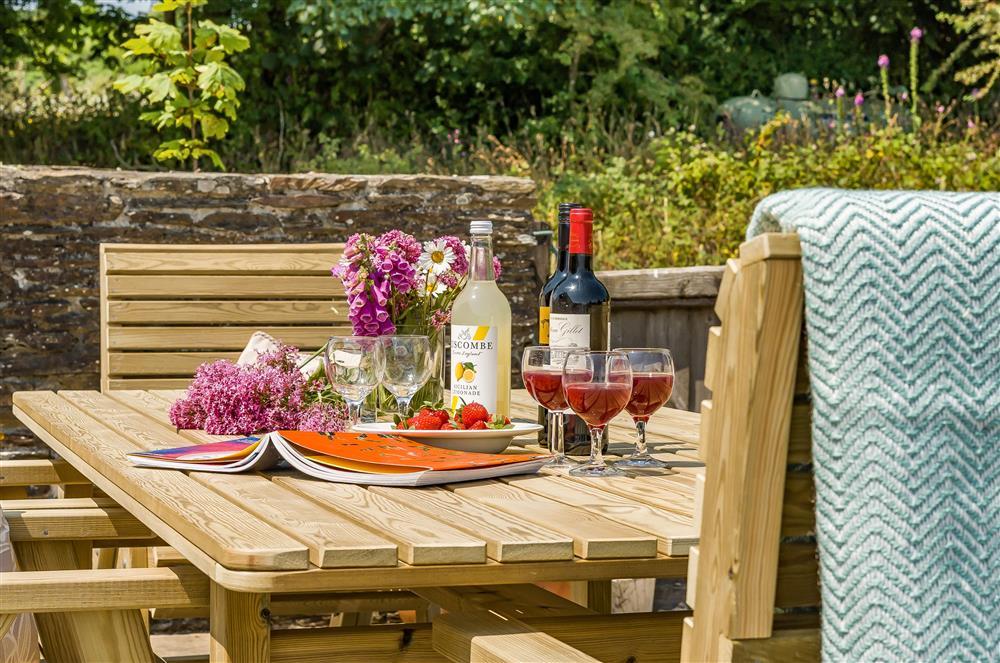 A lovely spot on the terrace to enjoy alfresco dining at Hayloft Cottage, Totnes
