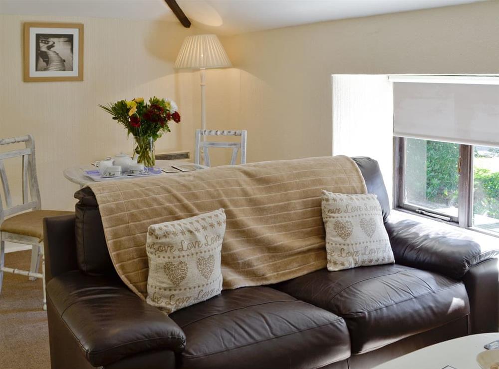 Charming living room with dining area at Hayloft in Liskeard, Cornwall