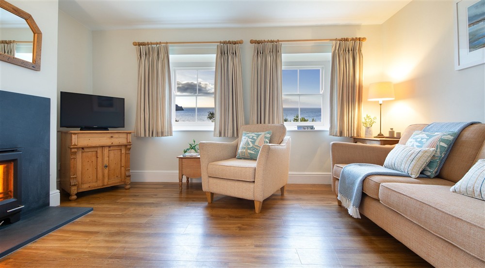 The sitting room, with sea views, at Hayloft in Truro, Cornwall