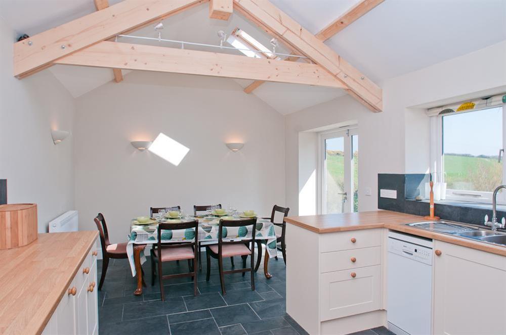 Open plan kitchen and dining area at Hazel Cottage in Malborough, Nr Salcombe
