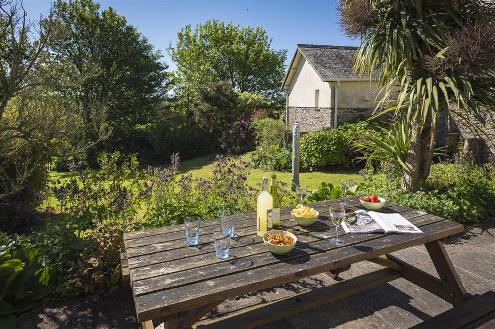 Terrace with picnic table at Hazel Cottage in Malborough, Nr Salcombe