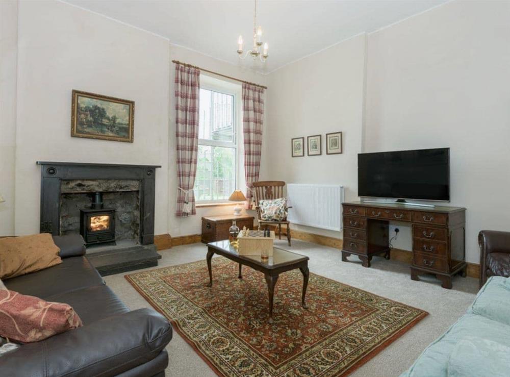 Spacious living room with wood-burning stove at Hazel Grove House in Near Kirkby Lonsdale, Lancashire