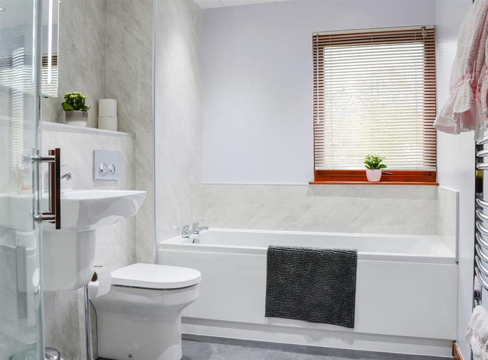 Bathroom with shower cubicle and heated towel rail at Hazelmere in Rattray, near Blairgowrie, Perthshire