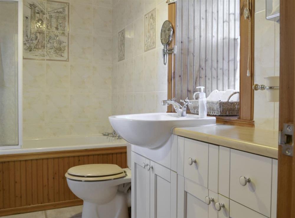 Family bathroom with shower over bath at Hazels Cottage in Tangy, near Campbeltown, Argyll and Bute, Scotland