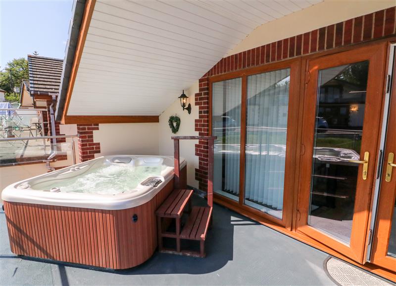 There is a hot tub at Hazelwood Lodge, High Bickington