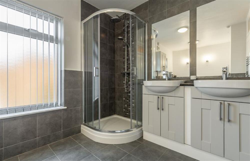 First Floor: Large family bathroom with stand alone bath, separate shower and twin wash basins  at Heacham Hidey Hole, Heacham near Kings Lynn
