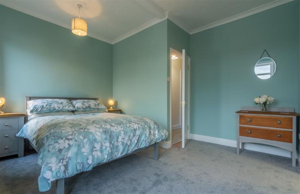 First Floor: Master bedroom with double bed at Heacham Hidey Hole, Heacham near Kings Lynn