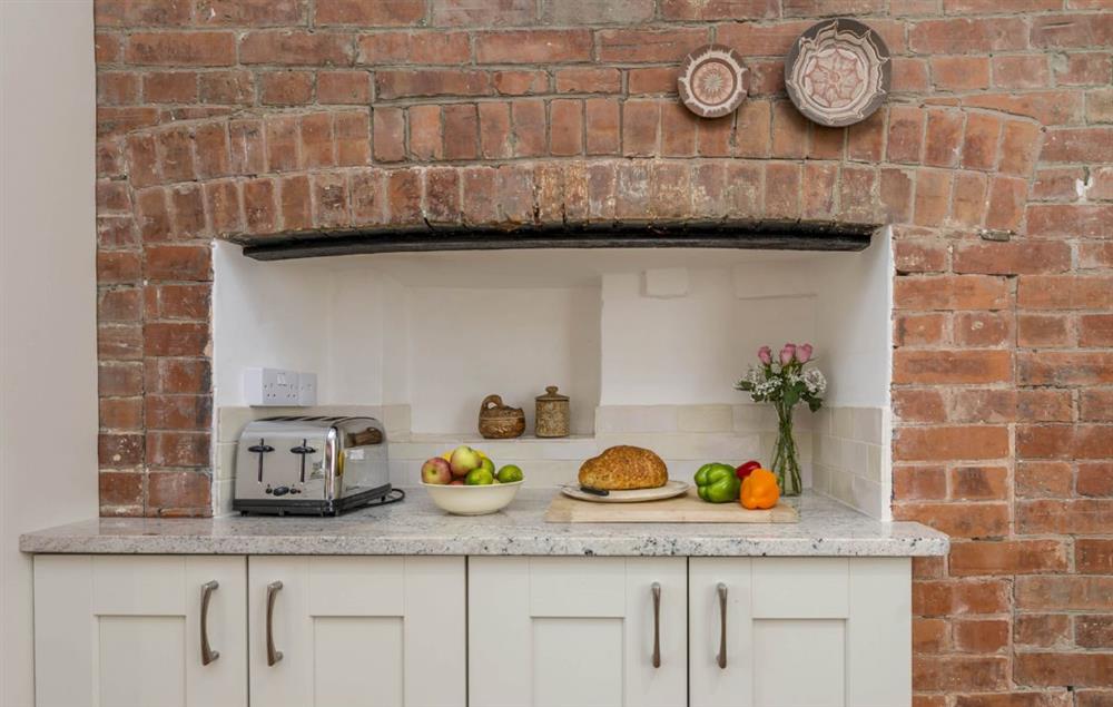 Exposed brick in this magnificent farmhouse kitchen at Hearn Lodge, Bishops Lydeard