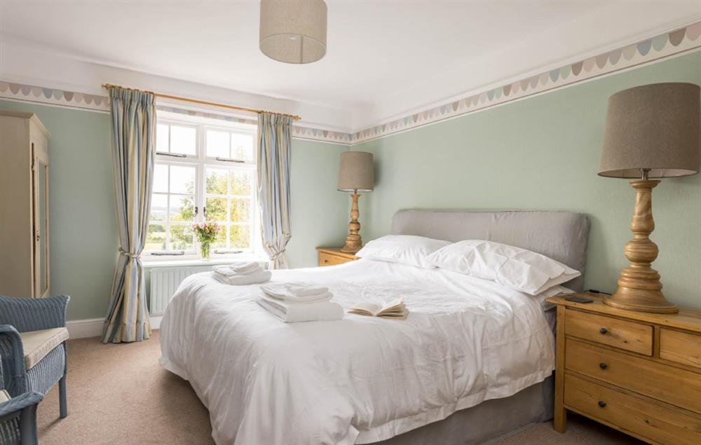 Master bedroom with 6’ super king size bed at Hearn Lodge, Bishops Lydeard