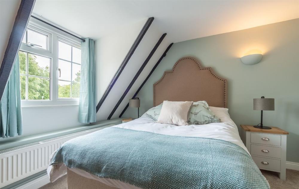 Double bedroom and original beams at Heath Cottage, Mattishall