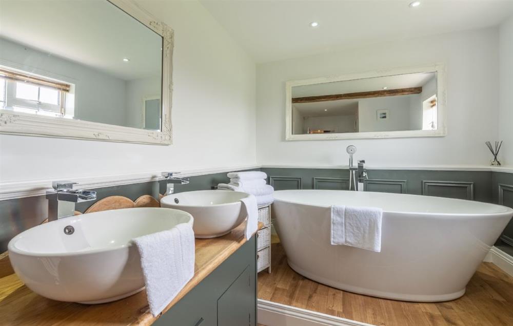 Family bathroom with bath and separate shower at Heath Cottage, Mattishall