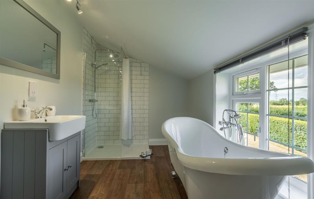 Modern bathroom with freestanding bath and separate walk-in shower at Heath Cottage, Mattishall