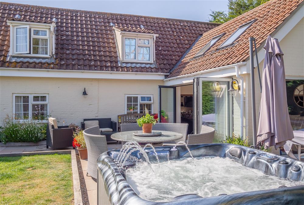 Relax in the deluxe hot tub at Heath Cottage, Mattishall