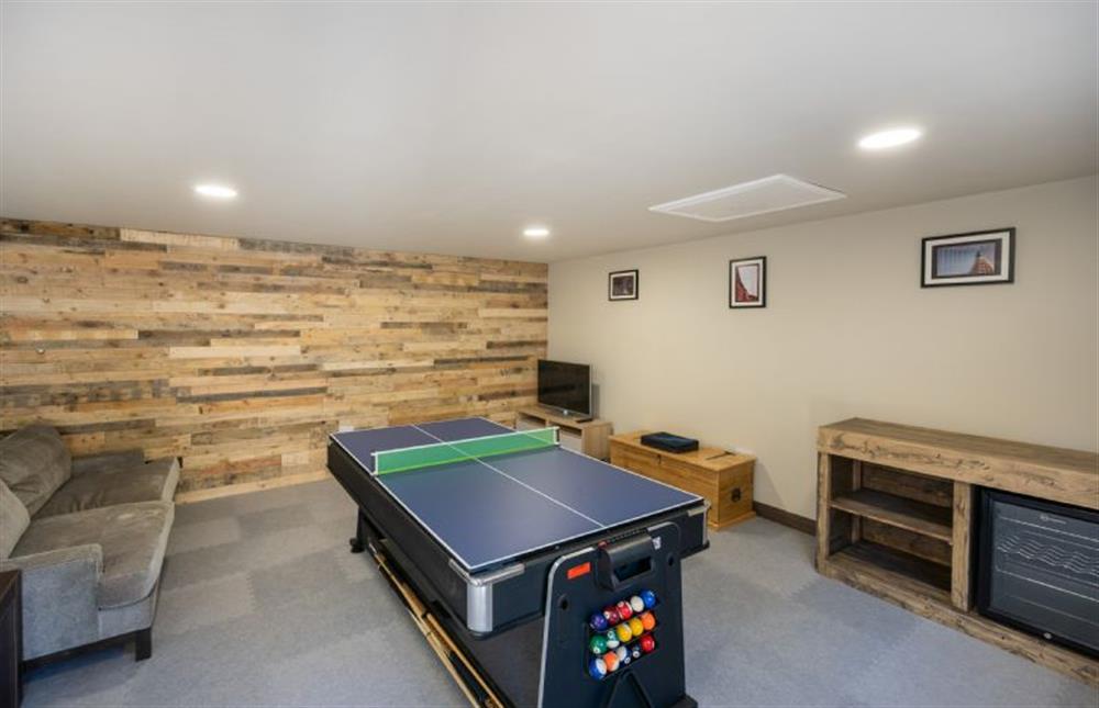 Games room/ office with Smart TV, sofa and table tennis, pool and air hockey at Heathcot, High Kelling near Holt