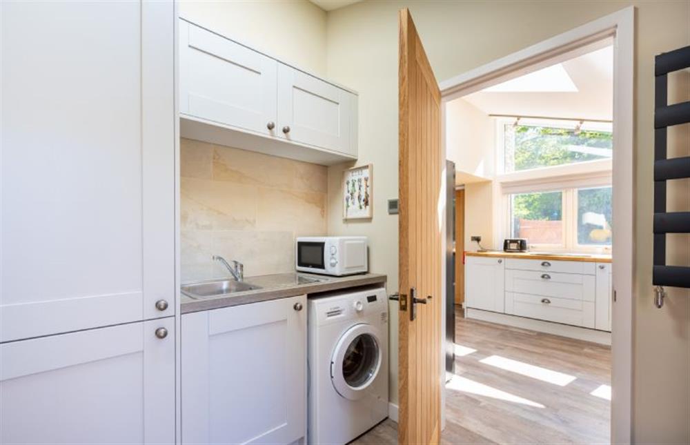 Ground floor: Utility with washing machine and microwave at Heathcot, High Kelling near Holt