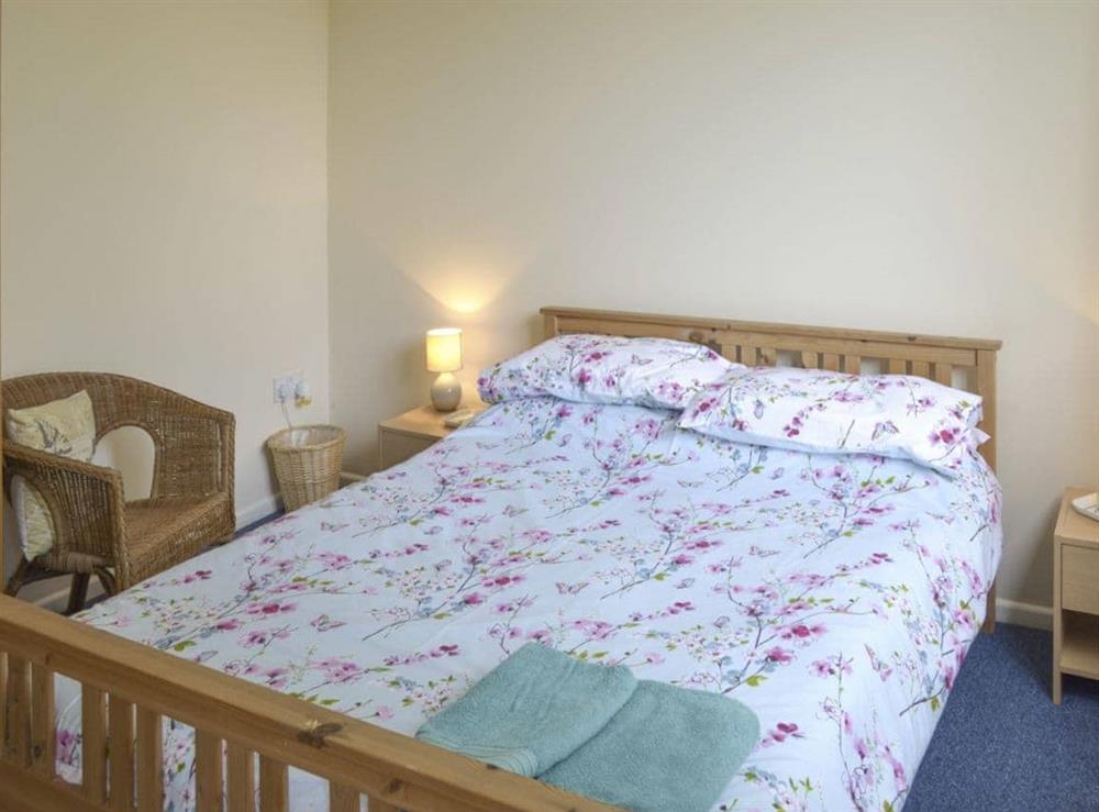 Peaceful double bedroom with ample storage at Heather Brae Lodge in Nancledra, near Penzance, Cornwall