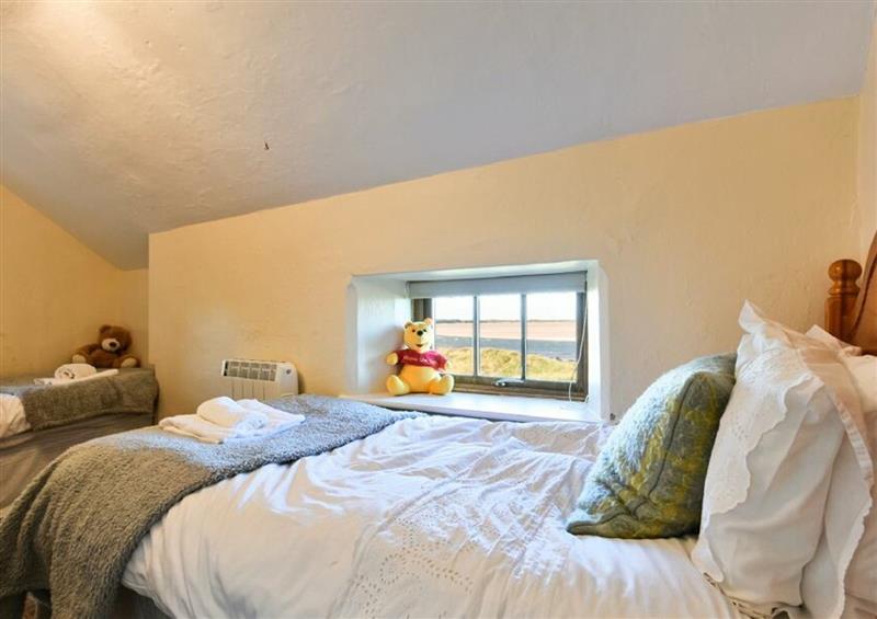This is a bedroom at Heather Cottages - Godwit, Bamburgh
