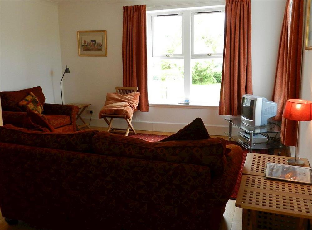 Open plan living space at Heathfield Cottage in Brodick, Isle of Arran, Scotland