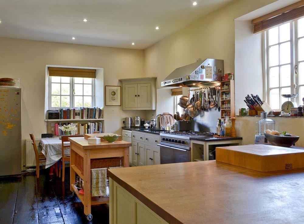 Kitchen with dining area at Heathfield Down Farmhouse in Modbury, S. Devon., Great Britain