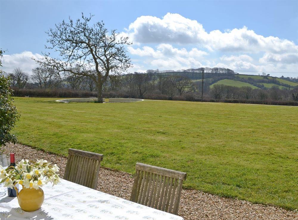 Outdoor dining area with BBQ at Heathfield Down Farmhouse in Modbury, S. Devon., Great Britain