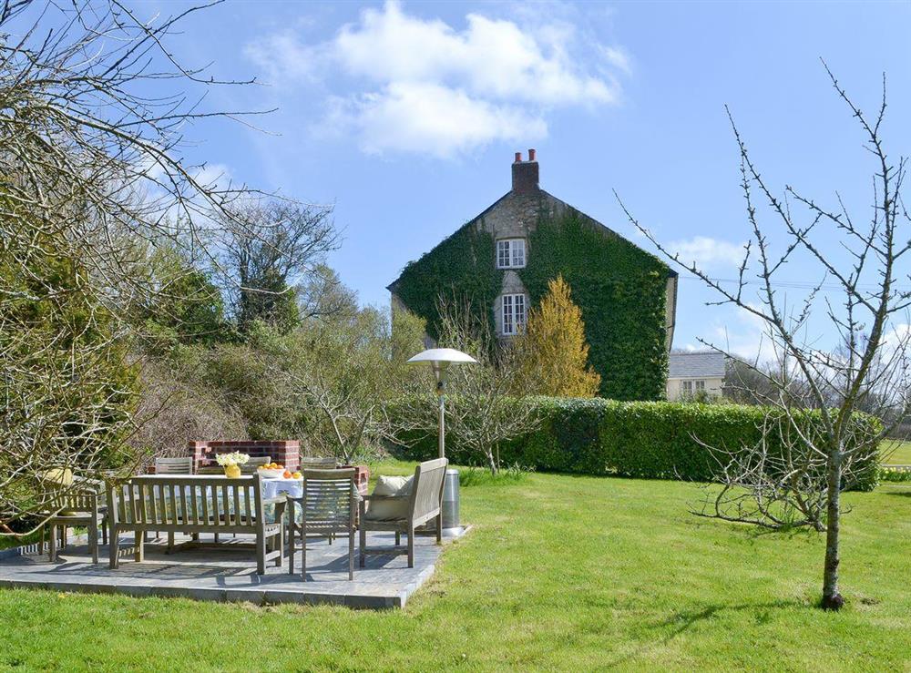 Outdoor dining area with BBQ at Heathfield Down Farmhouse in Modbury, S. Devon., Great Britain