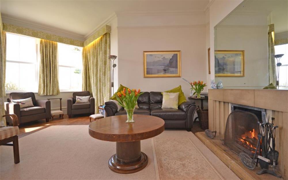 The spacious lounge with fireplace at Heathfield in Thurlestone