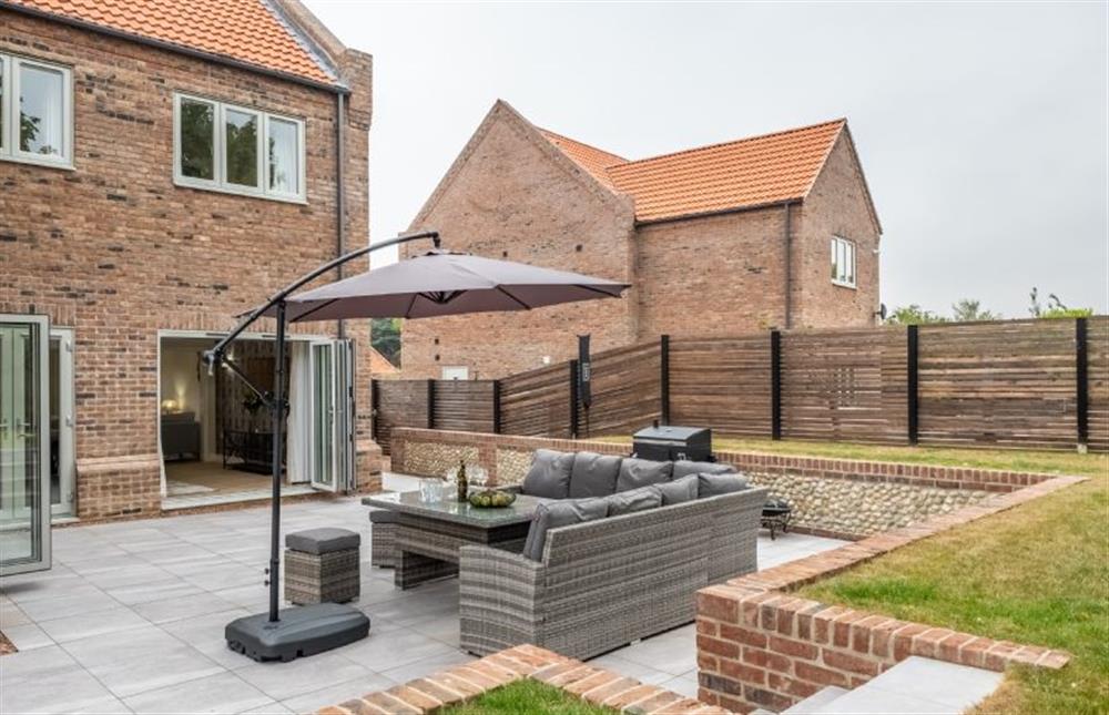 A generous patio with a seating area at Hedgerows, Burnham Market near Kings Lynn