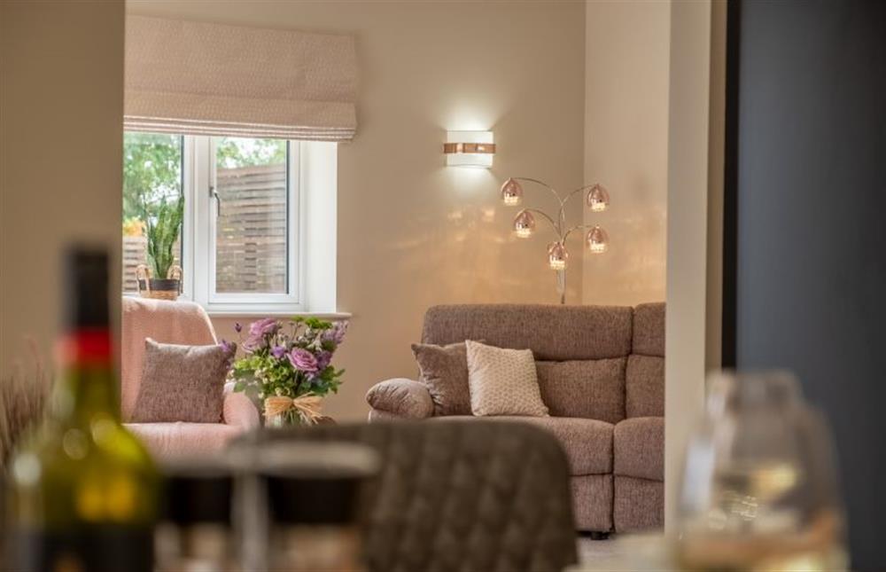 A view of the sitting room from the dining area at Hedgerows, Burnham Market near Kings Lynn