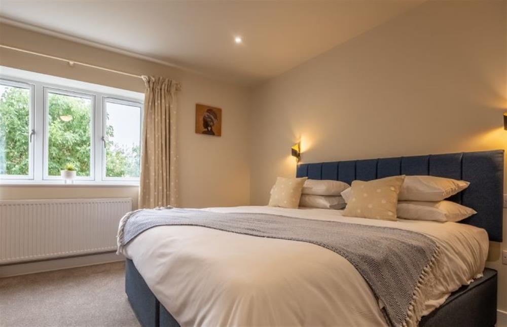 Master bedroom with 6’ super-king bed (photo 2) at Hedgerows, Burnham Market near Kings Lynn