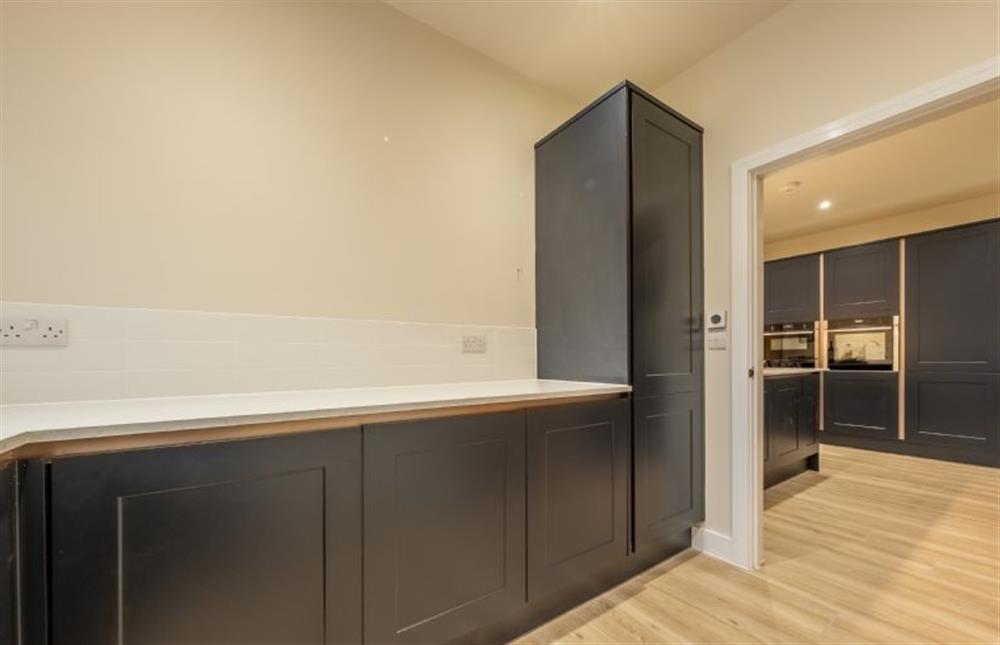 The kitchen leads through to a utility room at Hedgerows, Burnham Market near Kings Lynn