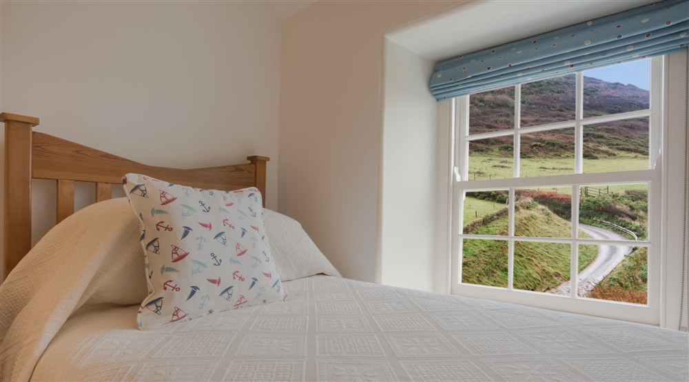 The countryside view from the twin bedroom at Hemmick Cottage in Cornwall,