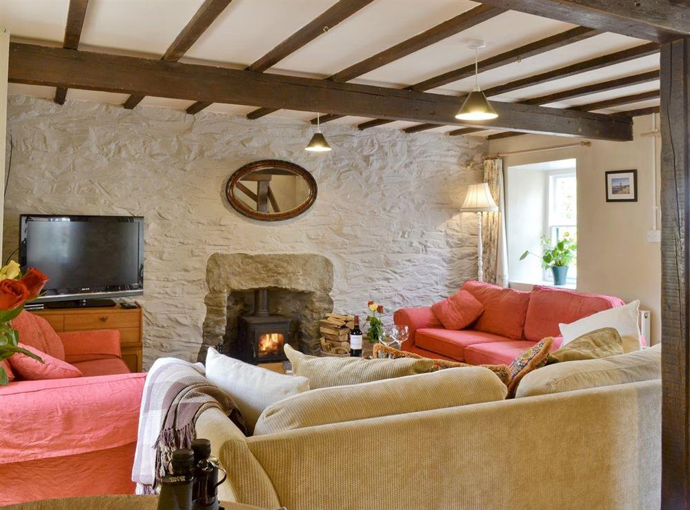 Exposed wood beams in living room at Old Smithy, 