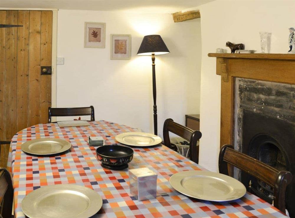 Lovely cottage dining room with feature fireplace at Hen Hafod in Bala, Gwynedd